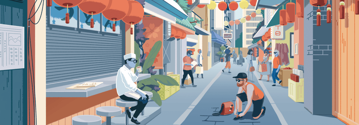 Street in Tokyo, Japan, with tourist, shopkeepers and colourful paper lanterns